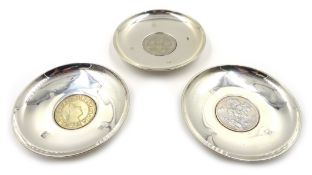 Three silver Armada dishes by David R Mills London 1998,set with 1951 five shilling coin,