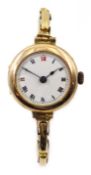 Early 20th century 9ct gold enamel faced wristwatch on expanding 9ct gold bracelet