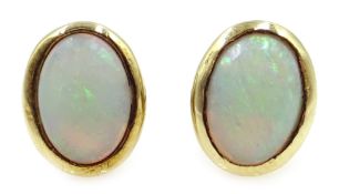 Pair of 9ct gold oval opal stud earrings, hallmarked Condition Report Approx 1.