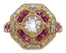 Gold ruby and diamond surround octagon dress ring, set with a central pale blue stone,