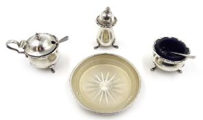 Three piece silver condiment set with spoons and blue glass liners and a butter dish,