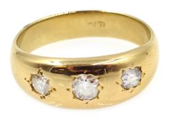 Gold three stone diamond gypsy ring, stamped 18c Condition Report Approx 4.