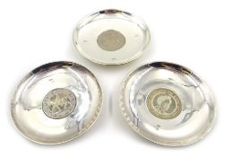 Two silver Armada dishes by David R Mills London 2002 and a similar dish by Bruford & Heming Ltd