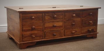 Hardwood coffee table, hinged lid, twelve drawers, shaped bracket supports, 118cm x 66cm,