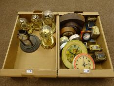 Brass carriage timepiece, four Anniversary type clocks under domes and a collection of alarm,