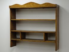 Early 20th century oak and elm wall rack, shaped cornice and three shelves, W95cm, H88cm,