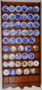 Pine display shelf with a collection of miniature plates including Coalport, Royal Copenhagen,
