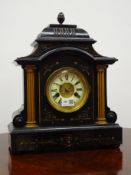 Victorian painted simulated black slate mantel clock with gilt columns and circular Roman dial,