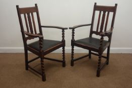 Pair early 20th century oak elbow chairs, drop in seats on barley twist supports,