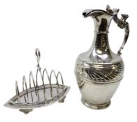 Silver-plated claret jug, the body decorated with two mythical winged creatures,