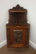 Early 20th century floral and sea horse carved oak wall hanging corner cupboard, W43cm, H93cm,