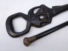 Victorian ebonised walking stick with silver pommel and a carved African walking stick,