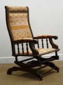 American walnut framed rocking chair, upholstered back, arms and seat,