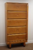 Mid 20th century light oak cabinet, five up and over doors enclosing fitted interior,