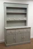 Painted dresser, two shelves with four small and three long drawers above three cupboards doors,
