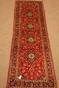 Ardabil red ground runner, repeating border, four medallions on a floral field,