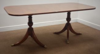 Regency style mahogany rectangular dining table, twin pedestal base, sabre supports,