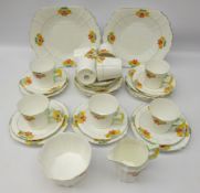 Art Deco Royal Stafford tea service for eight painted with nasturtium with floral moulded handles