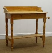 Early 20th century solid pine wash stand, raised back, turned supports, joined by an undertier,