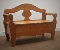 Traditional pine bench with box seat, arched back with shaped splat, solid end supports,
