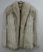 Saga Fox short fur coat,
