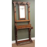 Early 20th century oak hallstand with bevel edge mirror, seven hooks,