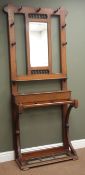 Early 20th century oak hallstand with bevel edge mirror, seven hooks,