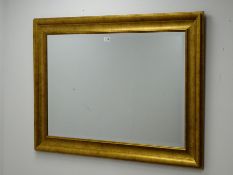 Rectangular gilt framed bevel edged mirror, W111cm,