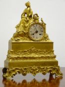 Late 19th century French gilt metal figural mantel clock, seated female with circular silvered dial,