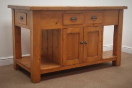 Solid pine kitchen island fitted with six drawers and four cupboards, on square supports,