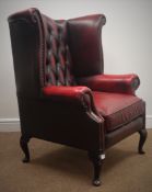 Georgian style wingback armchair upholstered in ox blood red leather,