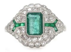 Platinum (tested) emerald and diamond dress ring