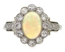 Early 20th century rim set opal and diamond cluster ring,