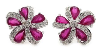 Pair of white gold ruby and diamond stud earrings,