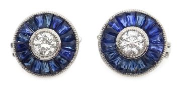 Pair of platinum (tested) round cut diamond and calibre cut sapphire target design earrings