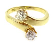 Gold two stone old cut diamond cross-over ring stamped 18ct Condition Report size