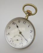 Early 20th century nickel banded bull's eye table clock, the white enamel dial with Arabic numerals,