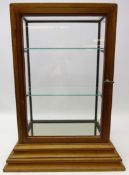 Early 20th century oak table top glazed shop display cabinet, with hinged door to reverse,