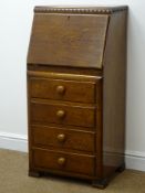 Early 20th century narrow oak four drawer bureau, front enclosing fitted interior, four drawers,