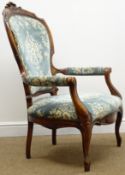 Victorian style walnut framed armchair, floral carved cresting rail, upholstered back arms and seat,