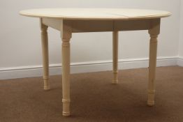 Circular extending dining table, three leaves, turned supports, painted cream finish, 243cm x 122cm,
