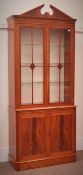 Charles Barr quality reproduction mahogany bookcase display cabinet on cupboard, swan neck pediment,