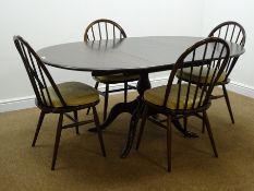 Set four Ercol hoop back chairs and an Ercol circular extending dining table with four splayed
