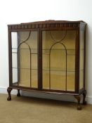 Early 20th century bow fronted display cabinet, raised shaped back,