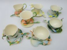 Seven Franz sculptured porcelain cup, saucer & spoon sets comprising Bee, Calla Lily,