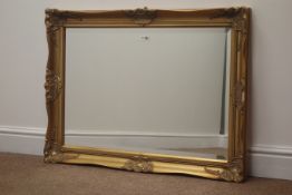 Glit framed rectangular bevel edged mirror with floral mouldings, W90cm,