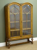 Early 20th century oak double arched top bookcase,