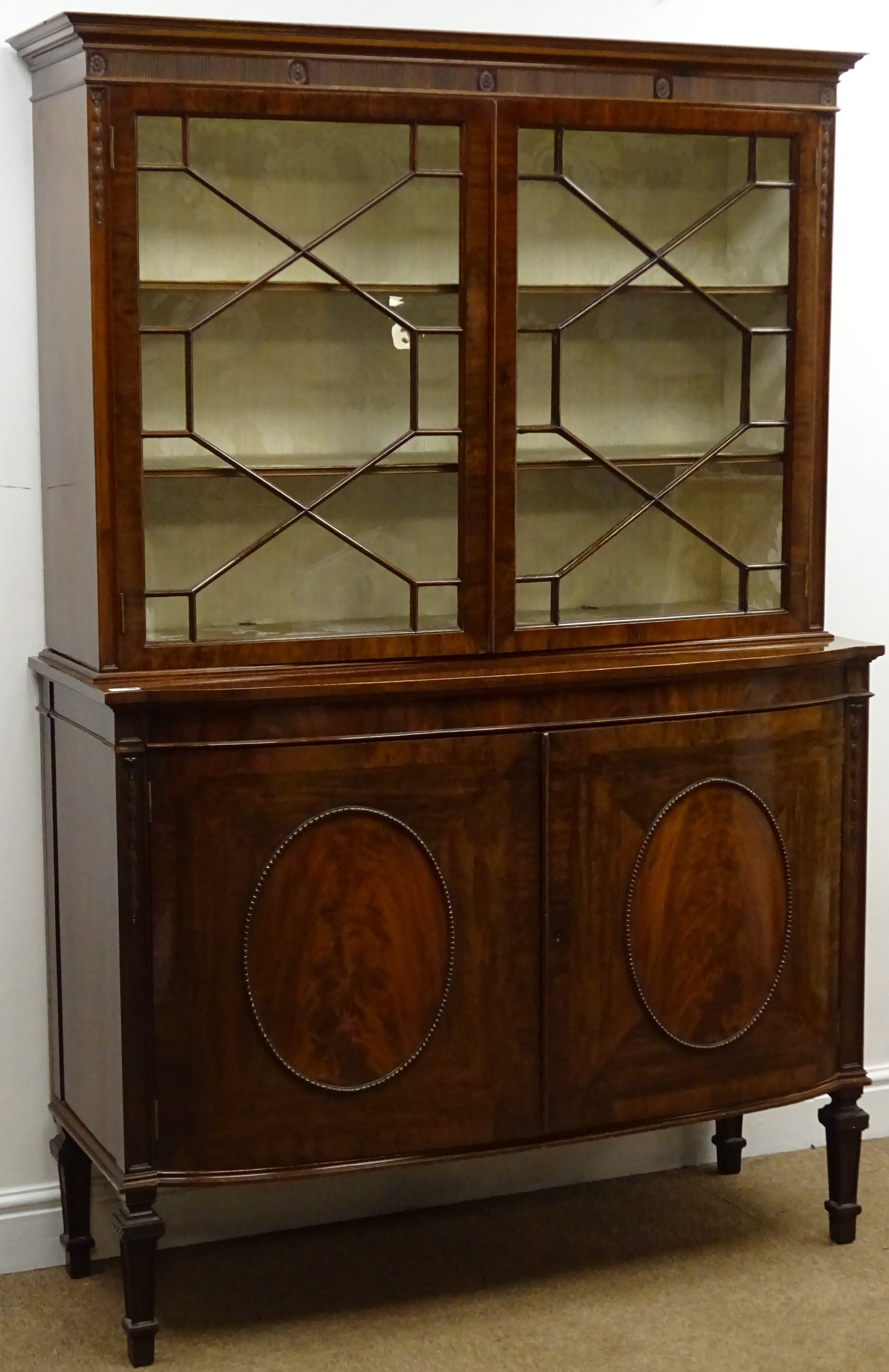 Early 20th century bow fronted walnut sideboard, projecting cornice,