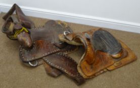 Two tooled leather Western style saddles,