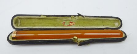 George V amber cigarette holder with 9ct gold mount, 1919 in original case,